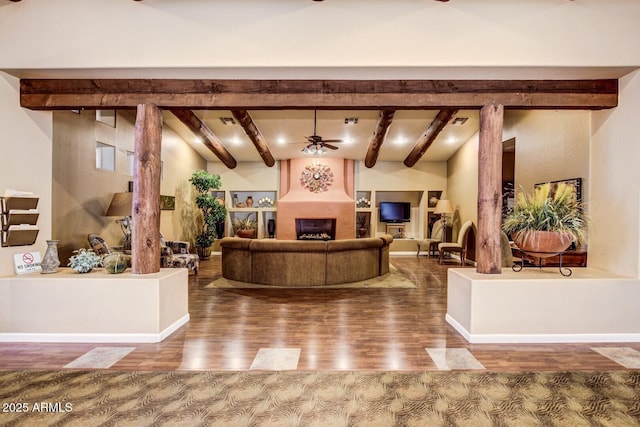 reception featuring ceiling fan and a large fireplace