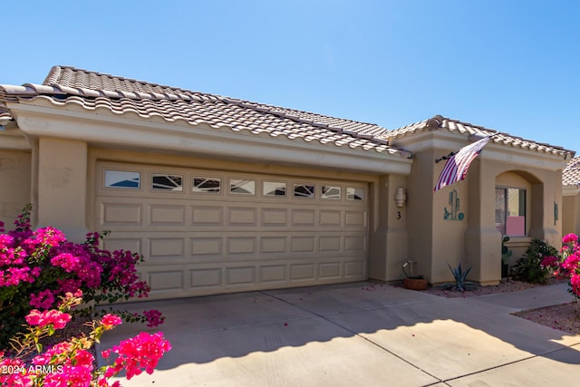 view of front of property featuring a garage