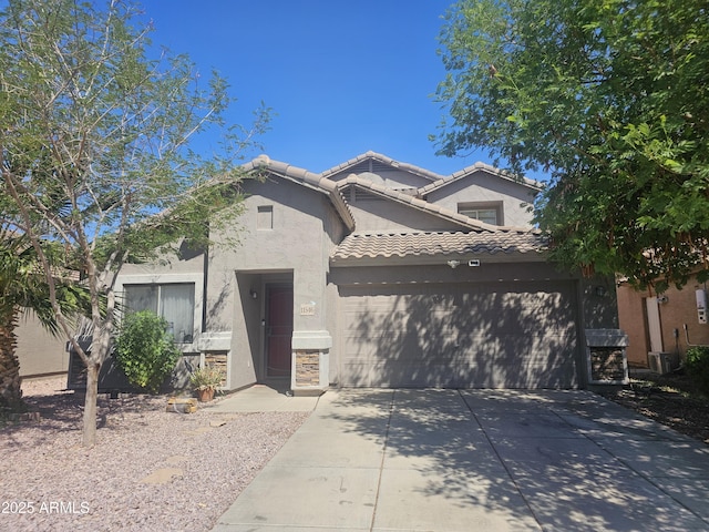 view of front of house featuring driveway, a garage, a tile roof, central air condition unit, and stucco siding