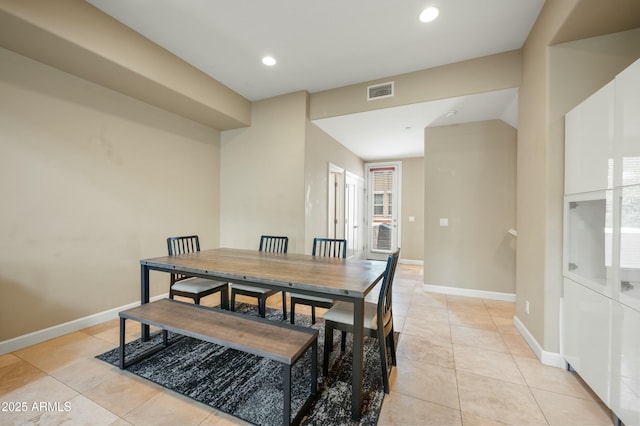 dining space with light tile patterned floors, visible vents, recessed lighting, and baseboards