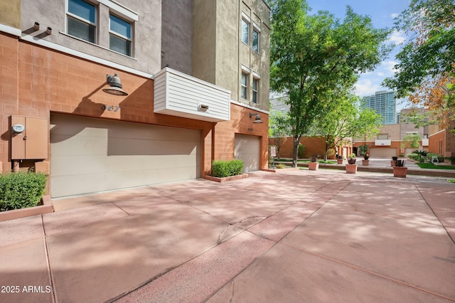 exterior space with driveway and a garage