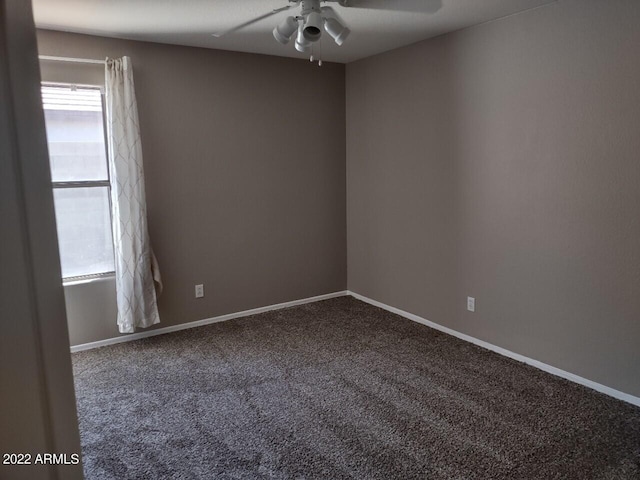 carpeted empty room featuring ceiling fan