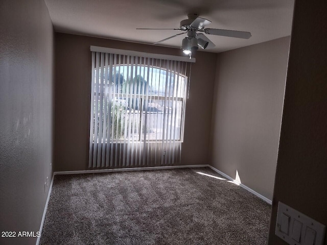 carpeted empty room with ceiling fan