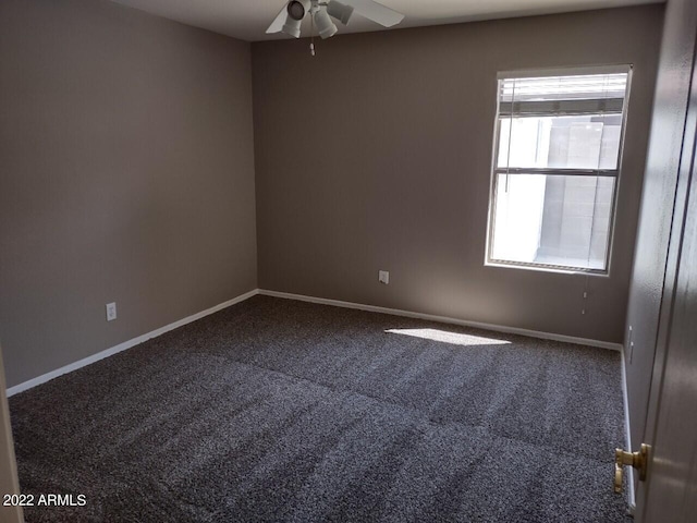 empty room featuring carpet flooring and ceiling fan