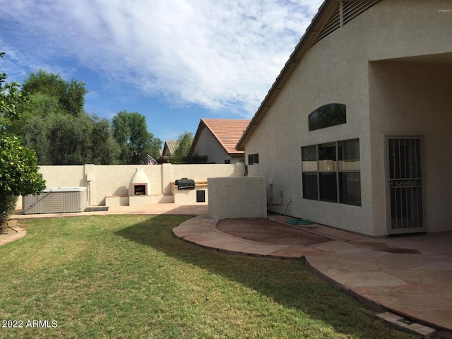 view of yard featuring central AC unit and a patio area