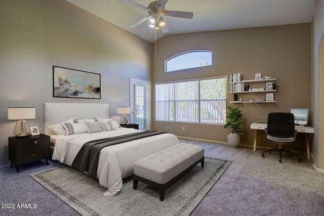 carpeted bedroom featuring ceiling fan and vaulted ceiling