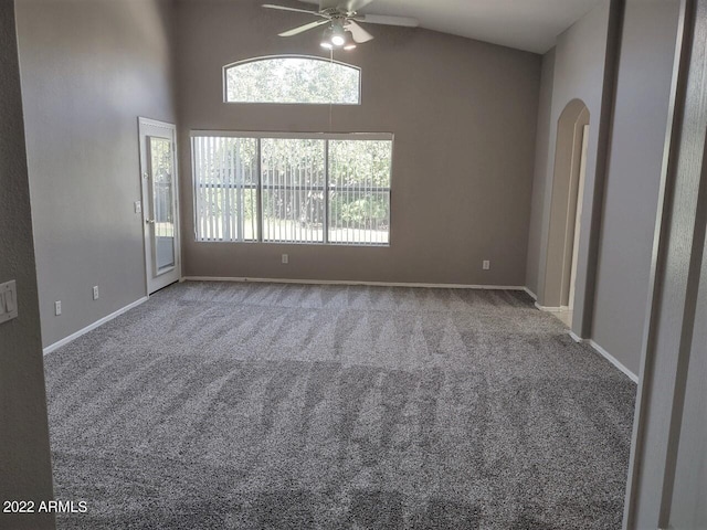 spare room with ceiling fan, lofted ceiling, and carpet floors