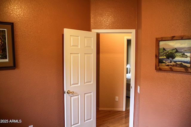 corridor featuring hardwood / wood-style flooring