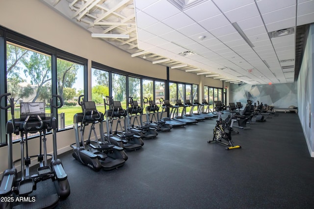 gym with a paneled ceiling