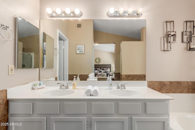 6430 E Riverdale St, Mesa, AZ 85215 - full bathroom featuring double vanity and a garden tub