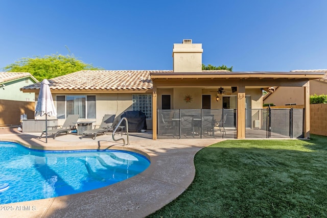 6430 E Riverdale St, Mesa, AZ 85215 - back of house featuring a chimney, a patio area, stucco siding, and a tiled roof