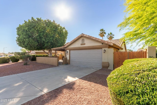 6430 E Riverdale St, Mesa, AZ 85215 - single story home featuring stucco siding, a garage, driveway, a tiled roof, and a gate