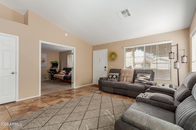 6430 E Riverdale St, Mesa, AZ 85215 - living area with lofted ceiling, healthy amount of natural light, and baseboards