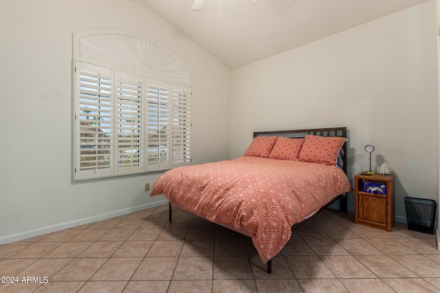 tiled bedroom with vaulted ceiling and ceiling fan