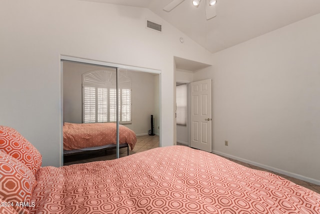 bedroom featuring high vaulted ceiling, a closet, carpet flooring, and ceiling fan