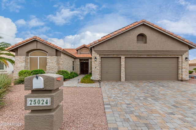 view of front of home with a garage