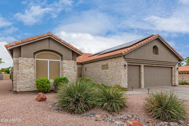 view of front of home with a garage