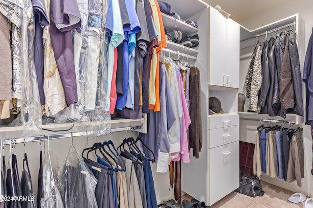 spacious closet featuring light tile patterned flooring