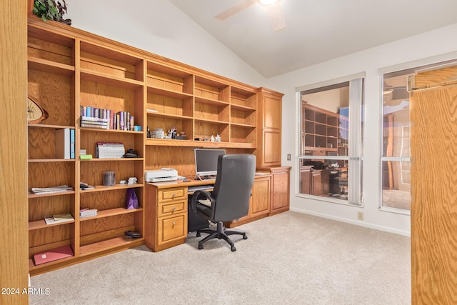 office space featuring lofted ceiling, light colored carpet, and ceiling fan