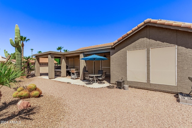 rear view of property with a patio