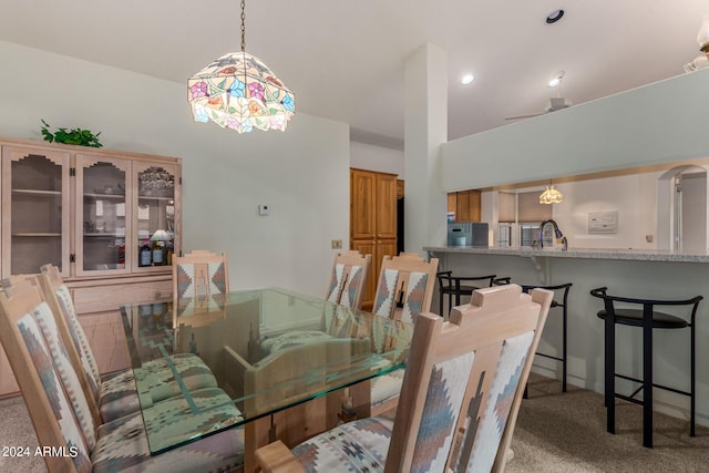 dining room with sink and carpet