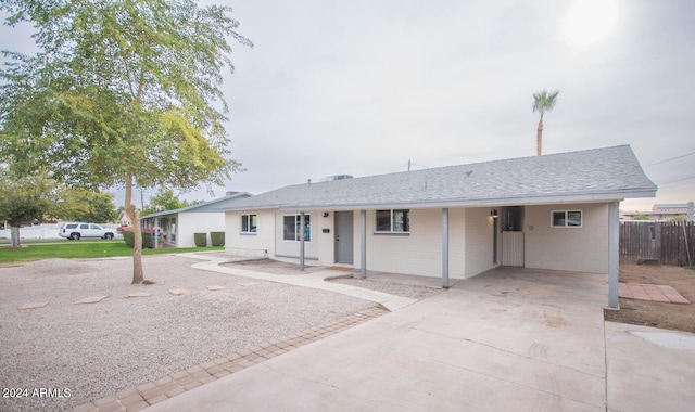 ranch-style home with a carport