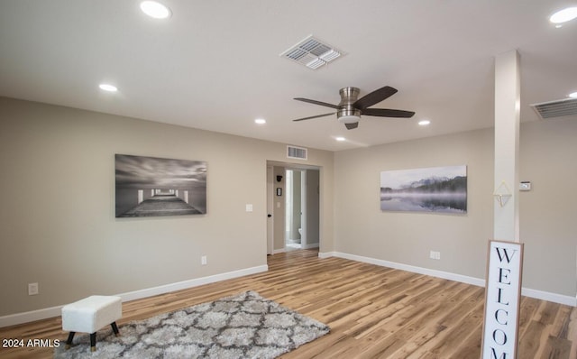 interior space with light wood-type flooring and ceiling fan