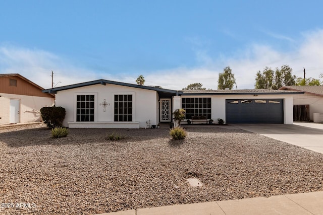 ranch-style home with a garage