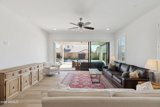 living room with ceiling fan, light wood finished floors, and recessed lighting