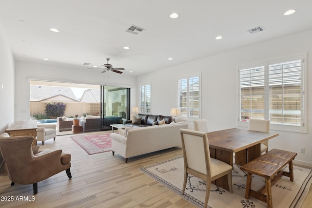 living area with ceiling fan, light wood-type flooring, visible vents, and recessed lighting