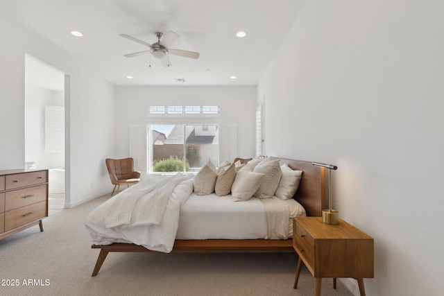 bedroom with baseboards, light colored carpet, ceiling fan, ensuite bathroom, and recessed lighting