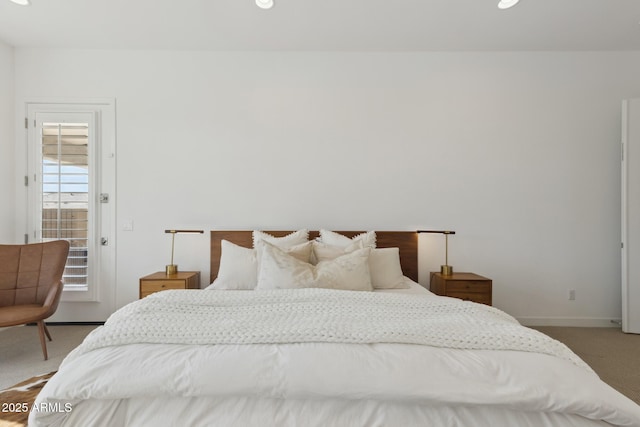 carpeted bedroom featuring baseboards and recessed lighting