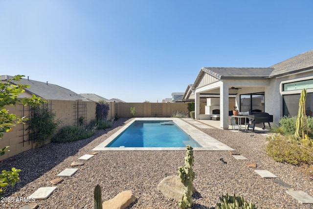 view of pool featuring a patio, a fenced backyard, a fenced in pool, and a ceiling fan