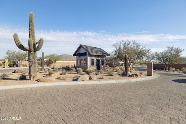 view of front of home featuring a standing seam roof