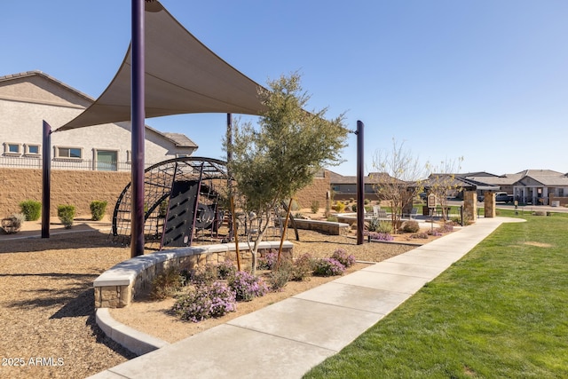 surrounding community featuring a yard and a residential view