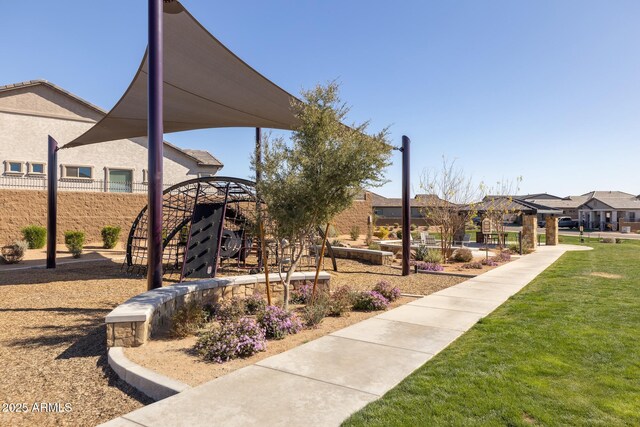 view of home's community with a lawn and a residential view