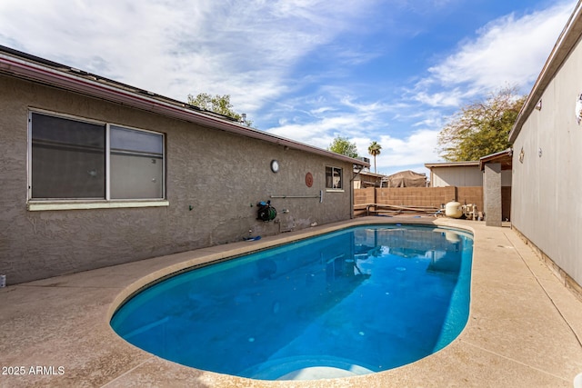 view of pool with a fenced in pool, a fenced backyard, and a patio