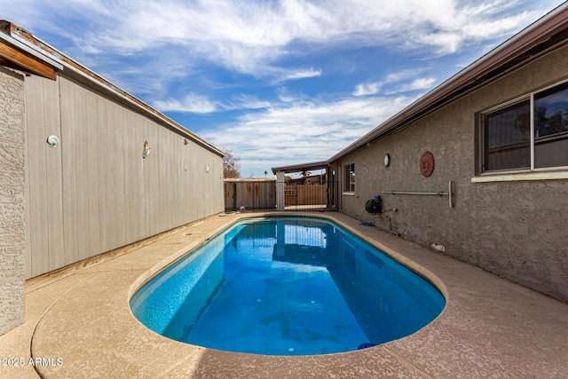 view of pool featuring fence, a patio, and a fenced in pool