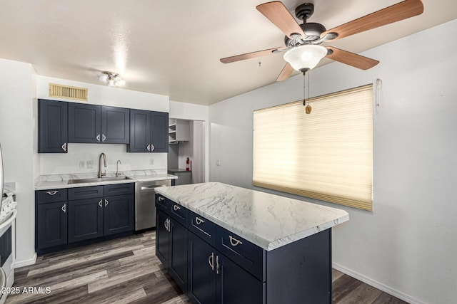 kitchen featuring a center island, light countertops, visible vents, a sink, and dishwasher