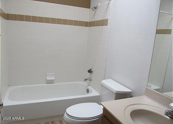 full bathroom featuring toilet, tub / shower combination, and vanity