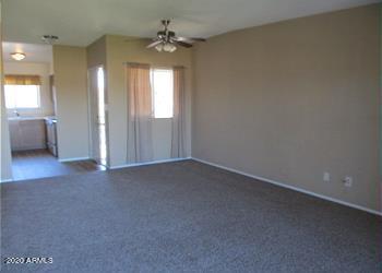 unfurnished room with ceiling fan