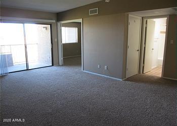 spare room with carpet floors and visible vents