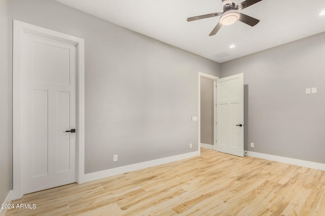 unfurnished room with light hardwood / wood-style flooring and ceiling fan