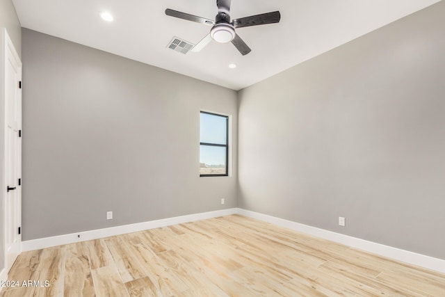 unfurnished room with ceiling fan and light wood-type flooring