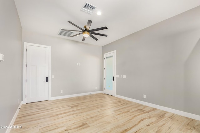 unfurnished room with ceiling fan and light wood-type flooring