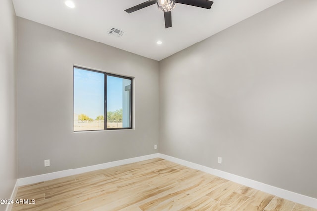 unfurnished room featuring ceiling fan and light hardwood / wood-style flooring