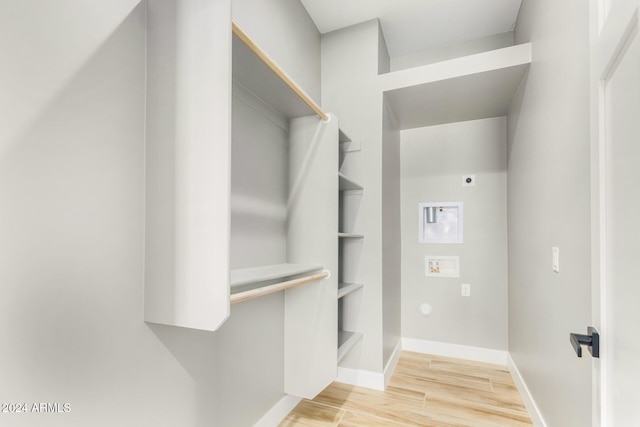 spacious closet featuring hardwood / wood-style flooring