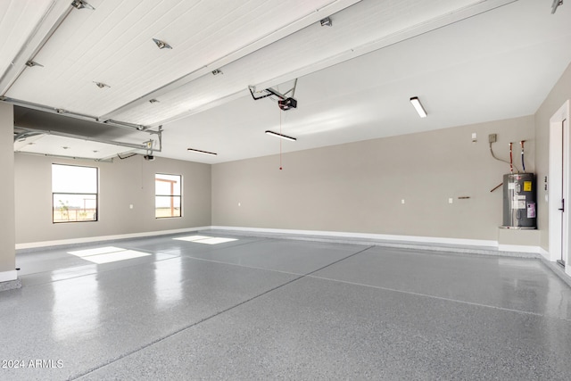 garage featuring a garage door opener and water heater