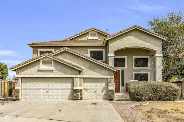 view of front of home featuring stone siding, fence, concrete driveway, and stucco siding