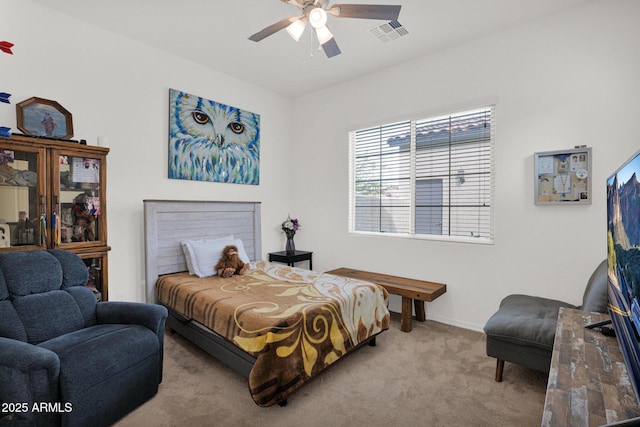 bedroom with ceiling fan and light carpet